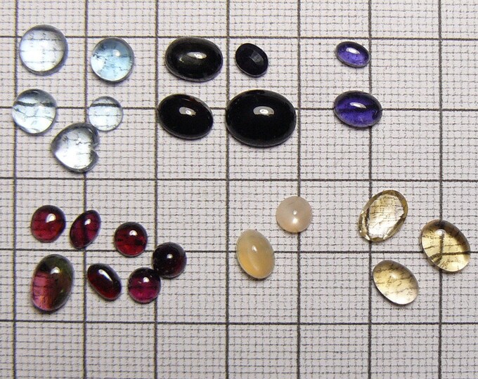 Lot of 23 small semi precious stones for accent or replacement, 5 Aqua, 7 Garnets, 3  Citrine (1 is 6x8 faceted), 8 unknown.   (C21931)