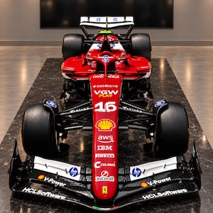 May include: A red and white Formula 1 race car featuring the number 16 on the nose cone. The vehicle displays various sponsor logos including HP, VGW Play, Shell, AWS, IBM, Pirelli, Celsius, UniCredit, V-Power, and HCLSoftware on its bodywork.