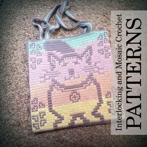 May include: A crocheted tote bag with a colorful pixelated design of a cat. The bag has a light blue, pink, yellow, and gray color scheme. The text "Interlocking and Mosaic Crochet PATTERNS" is visible in the image.