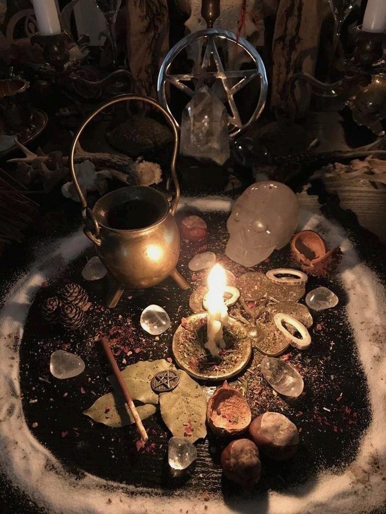 May include: A mystical scene featuring a small brass cauldron, a lit candle, and a pentagram. Clear quartz crystals, dried herbs, and other ritualistic items are arranged on a dark surface, creating a spiritual ambiance. The image has a warm, inviting tone.