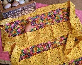 Egg apron / for gathering 12 deep pleated pockets backstitched for durability eggs won't bump and hands are free most 20x20long tie. Cotton