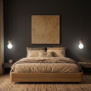 May include: A bedroom scene featuring a wooden bed frame with beige bedding and pillows. A large framed artwork hangs above the bed. Two pendant lights with spherical bulbs illuminate the space. The room has a dark gray wall and a patterned rug.