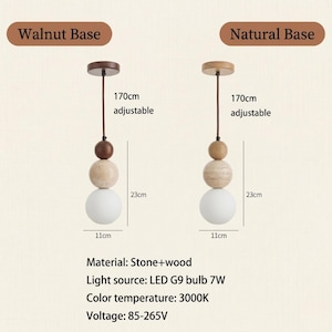 May include: Two pendant lights with a walnut and natural wood base. Each light features a series of stone and wood spheres, topped with a brown or natural wood cap. The bottom sphere is a white glass globe, 11cm in diameter. The lights are 170cm adjustable and 23cm in height.