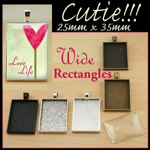 May include: A set of six silver, black, and bronze metal rectangular pendant trays, each measuring 25mm x 35mm. The trays have a textured surface and are designed to hold a variety of materials, such as resin, glass, or paper. The trays are shown with a clear glass insert and a sample image of a pink heart with the text "Love Life".