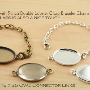 Peut inclure: Deux chaînes de bracelet à fermoir à langouste double de 12,7 cm avec des maillons ovales en verre. Les chaînes sont présentées avec des maillons ovales de 4,6 x 6,4 cm. Le texte "Shown with 5 inch Double Lobster Clasp Bracelet Chains OVAL GLASS IS ALSO A NICE TOUCH 18 x 25 OVAL CONNECTOR LINKS" est visible sur l'image.