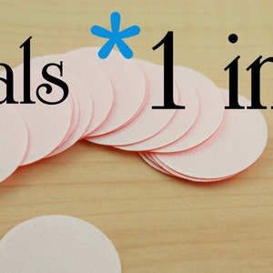 May include: A stack of 1 inch pink round seals. Seals * 1 inch.