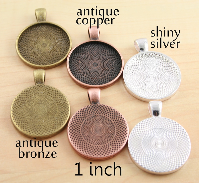 May include: Six 1-inch round metal blanks for jewellery making. The blanks are in antique copper, antique bronze, shiny silver, and copper.