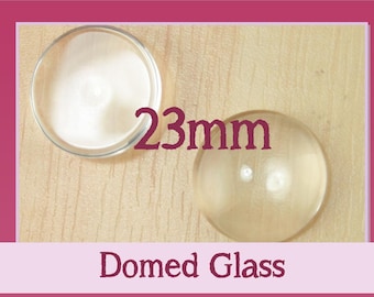 23mm Domed Round Glass Domes. 7/8 inch.  Flat on Back Side Glass. Perfect for Glass Dome Crafts . Match our 23mm Pendant Trays.