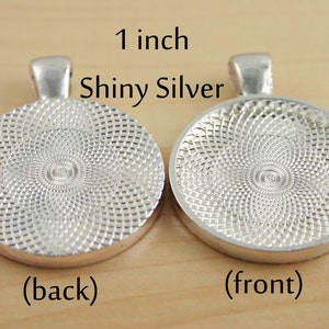 May include: A 1 inch shiny silver round pendant with a textured back and a smooth front. The pendant is for crafting and jewellery making.
