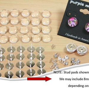 May include: A set of 25 clear glass cabochons, 40 silver earring posts, and 12 silver earring backs. The cabochons are 10mm in diameter. The earring posts are 8mm or 10mm in length. The earring backs are 8mm in diameter. The set is packaged in a black card with the text "purple mountain" and "Handmade in America". NOTE: Stud pads shown are 10mm. We may include 8mm or 10mm depending on availability.