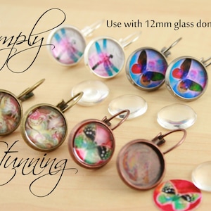 May include: Assortment of earrings with glass domes featuring butterfly and dragonfly designs. The earrings are made with bronze-colored metal and have a hook closure. The glass domes are 12mm in diameter. Use with 12mm glass domes.