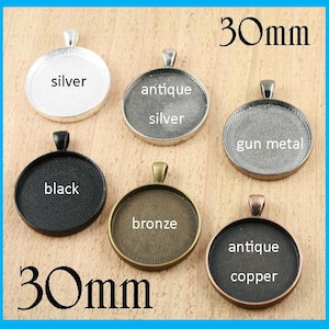 May include: Six 30mm round pendant trays in different finishes: silver, antique silver, gun metal, black, bronze, and antique copper.