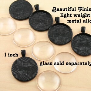 May include: A set of 1 inch black metal round pendant trays with a swirl design. The trays are made of a lightweight metal alloy and have a beautiful finish. Glass domes are sold separately.
