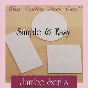 May include: Three white, rectangular, adhesive sheets on a wooden surface. The sheets are labeled "Jumbo Seals" and the text "Simple & Easy" is above the sheets. The text "Glass Crafting Made Easy!" is at the top of the image.