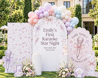 May include: A party backdrop set featuring an arched sign with the text Emily's First Karaoke Star Night, a rectangular panel with a bow and microphone pattern, and a scalloped sign with a microphone graphic and the text Emily Turns 1.