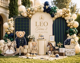 May include: A birthday party display featuring a large arch backdrop with the text LEO Turns 2 Two Years of Joy, surrounded by a balloon garland in cream, gold, navy, and dark green. Includes teddy bear cutouts, a rocking horse, and a pram.