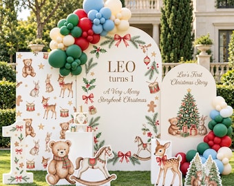 May include: A Christmas-themed party display featuring three arched backdrops with illustrations of teddy bears, deer, and toys. The center panel reads LEO turns 1 A Very Merry Storybook Christmas. Includes balloon arches and cutouts.