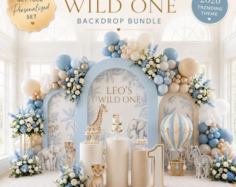 May include: A "Wild One" backdrop bundle with a light blue and white color scheme. The scene includes balloon arches, floral arrangements, and animal cutouts. The text "Leo's Wild One" is visible on the backdrop, along with the text "2026 Trending Theme".