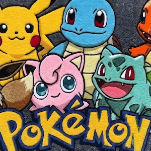 May include: A colourful rug featuring various Pokémon characters, including Pikachu, Squirtle, Charmander, Bulbasaur, Jigglypuff, and Eevee. The word "Pokémon" is displayed in yellow and blue. The rug is made of a soft, textured material.