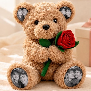 May include: A light brown plush teddy bear with curly fur holding a single red rose. The bear features circular photo prints on its ears and feet, displaying black and white portraits of a couple. Text above reads CUSTOM PHOTO TEDDY BEAR.