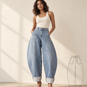 May include: A cream-coloured ribbed tank top paired with high-waisted, light-wash blue denim jeans featuring a wide-leg, balloon-shaped silhouette, large front patch pockets, and wide cuffs at the hem, accompanied by a black and white line drawing.