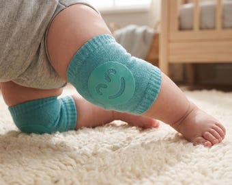 Ginocchiere colorate per neonati, antiscivolo, protettive per gattonare, morbide e sicure per le gambe dei bambini.