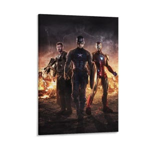 May include: A canvas print featuring three superheroes: Captain America, Iron Man, and Thor, standing in front of a fiery background. Captain America holds his shield, while Iron Man is in his red and gold suit. Thor is holding his weapon.
