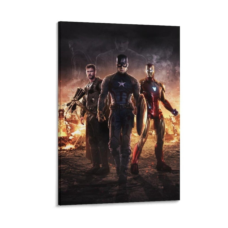 May include: A canvas print featuring three superheroes: Captain America, Iron Man, and Thor, standing in front of a fiery background. Captain America holds his shield, while Iron Man is in his red and gold suit. Thor is holding his weapon.
