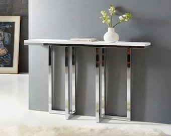 Consolle moderna bianca con gambe in metallo cromato, ideale per ingresso e corridoio.