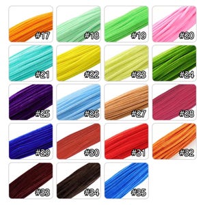 May include: A collection of twenty fuzzy pipe cleaners in various colors, each labeled with a number from 17 to 35. The colors include orange, mint, lime green, pink, turquoise, yellow, chartreuse, forest green, purple, light blue, tan, and red.