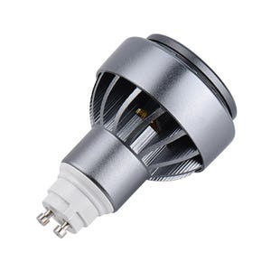 May include: A silver-colored LED light bulb with a unique design. The bulb has a cylindrical body with a series of vertical fins for heat dissipation. The base is white with two prongs. The bulb is designed for energy efficiency and long life.