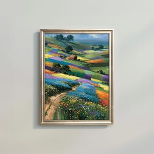 May include: A framed oil painting depicting a rolling landscape with a dirt path winding through vibrant fields of blue, yellow, and purple wildflowers. A small red house sits on a hillside under a blue sky with scattered trees and green hills.