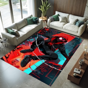 May include: A rectangular area rug featuring a superhero in a dynamic pose. The rug's design incorporates a vibrant color palette of red, black, and blue, with a cityscape backdrop. The superhero is depicted in a black suit with red accents.
