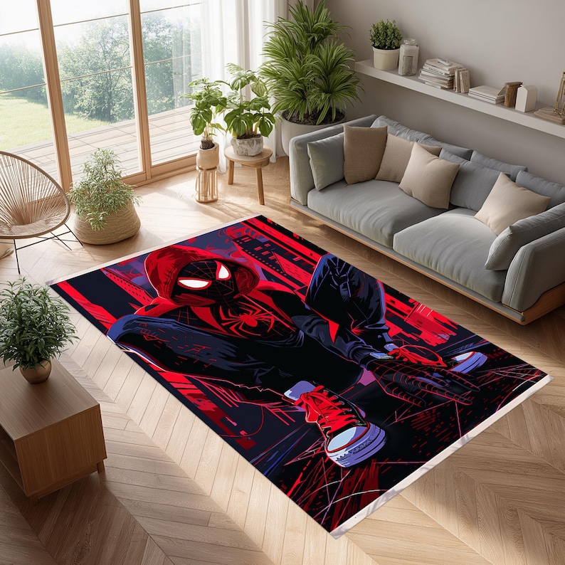 May include: A rectangular area rug featuring a comic book style illustration of a superhero in a red and black suit. The rug has a dark background with red and blue accents, and is placed in a living room setting.