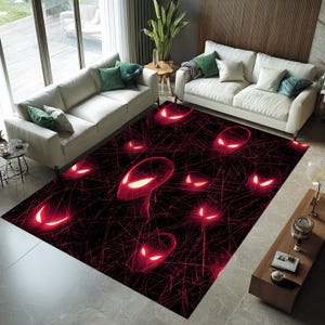 May include: A large, rectangular area rug with a black background and a repeating pattern of glowing red alien-like faces. The rug is placed in a living room setting with white sofas and green throw pillows.