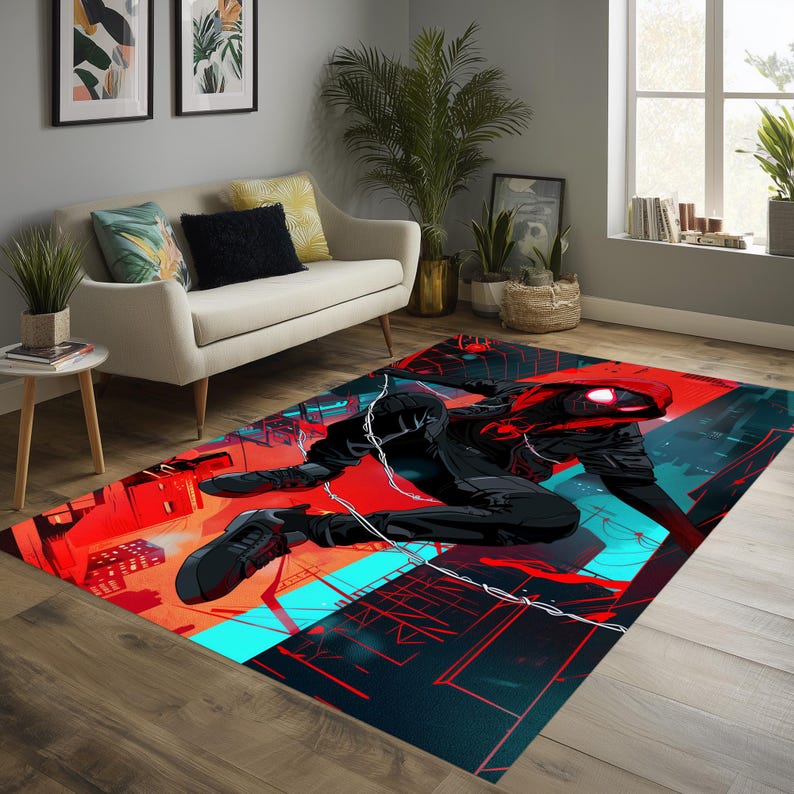 May include: A rectangular area rug featuring a dynamic illustration of a superhero in a red and black suit, set against a cityscape with red and teal accents. The rug is placed on a wooden floor.