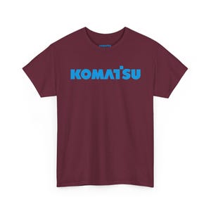 Komatsu Logo Tee | Construction Brand Shirt, Blue Text on Black Maroon