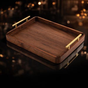 May include: A rectangular wooden serving tray with a dark brown finish and gold-coloured handles. The tray is made of wood and has a smooth surface. The handles are cylindrical and attached to the short sides of the tray.