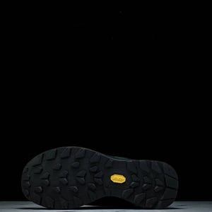 May include: Black hiking boot sole with a textured pattern and a yellow Vibram logo. The sole is designed for traction and durability, suitable for outdoor activities. The boot is likely for hiking or trail running.