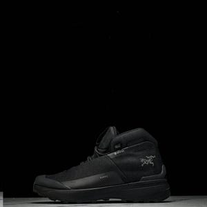 May include: Black hiking boot with a high-top design. The boot features a mesh upper, a thick sole, and the word "KOPIC" printed on the side. A logo of a bird is visible on the side of the boot.