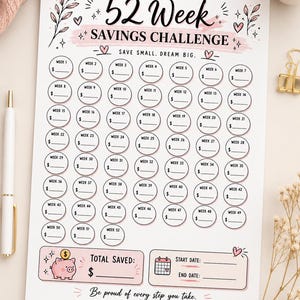 May include: A white 52-week savings challenge printable with a pink and black design. The text reads "Save Small, Dream Big." Includes spaces to track savings and a section for the total saved.