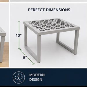 May include: A light gray metal shelf with a honeycomb pattern top. The shelf features an adjustable width design that slides from 8.5 inches to 15 inches wide. It stands 10 inches tall and is 8 inches deep, designed for use in lockers or cabinets.