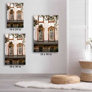 May include: Several canvas prints of a building facade with ornate windows and balconies are displayed. The prints vary in size, including 8 x 12 inches, 16 x 24 inches, 20 x 30 inches, 12 x 18 inches, and 24 x 36 inches. The building has a cream-colored exterior with brown trim.