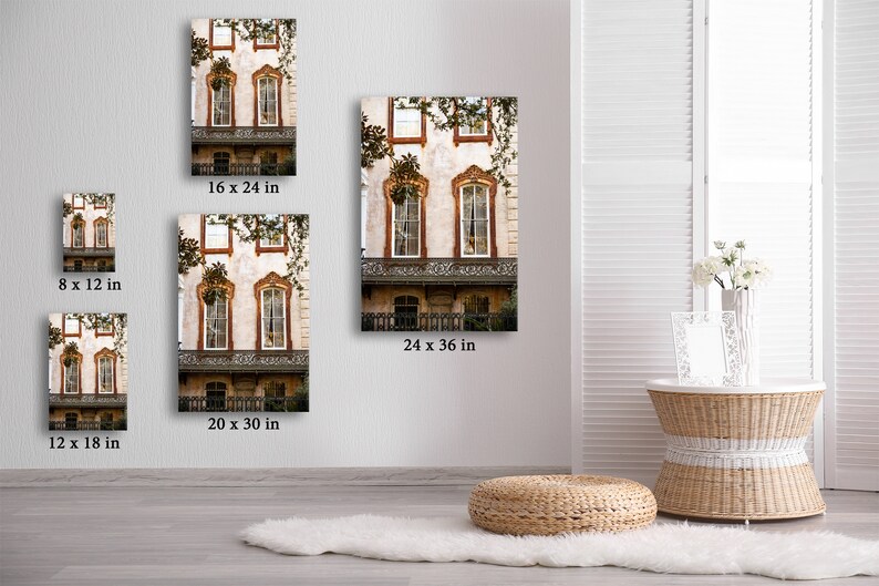 May include: Several canvas prints of a building facade with ornate windows and balconies are displayed. The prints vary in size, including 8 x 12 inches, 16 x 24 inches, 20 x 30 inches, 12 x 18 inches, and 24 x 36 inches. The building has a cream-colored exterior with brown trim.