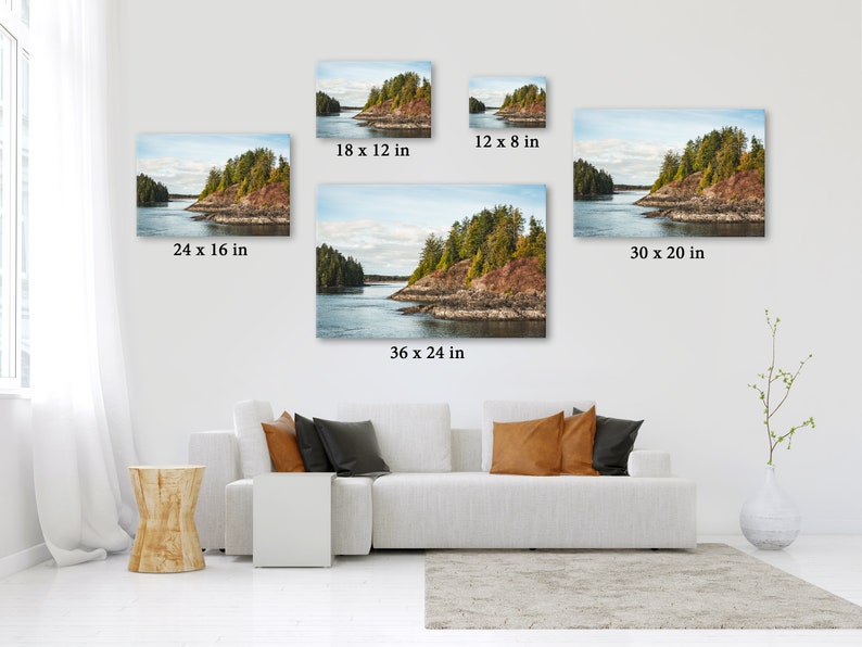 May include: A collection of landscape canvas prints in various sizes, including 24 x 16 inches, 18 x 12 inches, 12 x 8 inches, 36 x 24 inches, and 30 x 20 inches. The prints depict a scenic view of a coastal island with lush green trees and a calm body of water.