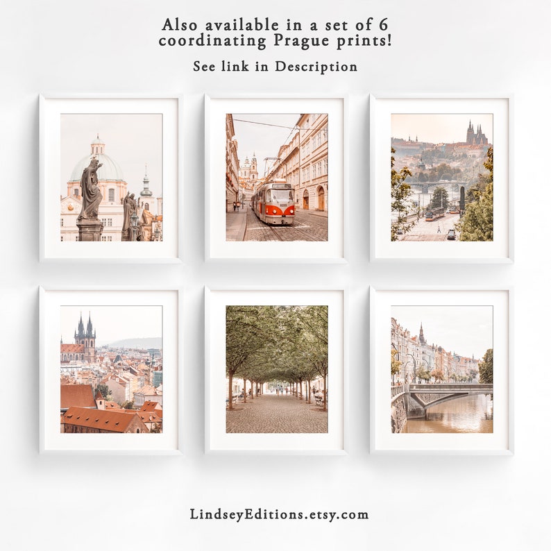 May include: Set of six coordinating prints featuring various scenic views of Prague, Czech Republic. The prints showcase iconic landmarks, including a church with a statue, a tram on a cobblestone street, a bridge over a river, and a tree-lined path.