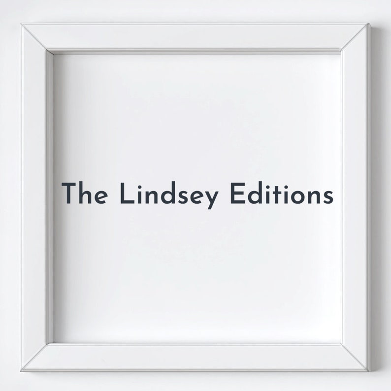 May include: A white framed print featuring the text "The Lindsey Editions" in a dark grey font. The frame is square and the background is white.