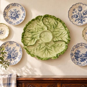 Bring a touch of garden-inspired charm to your table with this beautiful green cabbage-leaf platter. Sculpted leaf veins, softly ruffled edg