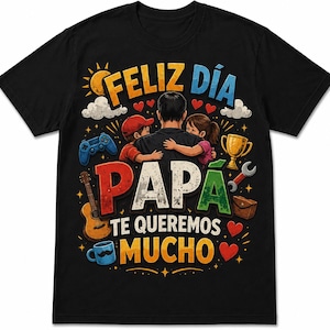 May include: A black short-sleeved t-shirt featuring a colorful graphic of a parent being hugged by two children. The text reads "FELIZ DÍA PAPÁ TE QUEREMOS MUCHO" surrounded by illustrations of a sun, clouds, a game controller, a trophy, a guitar, and hearts.
