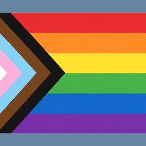 May include: A colorful flag with a rainbow design, featuring red, orange, yellow, green, blue, and purple stripes. It also includes a white, pink, light blue, brown, and black chevron on the left side. The flag is set against a blue background.